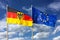 Flags of Germany Federal Republic of Germany; in German: Bundesrepublik Deutschland and the European Union EU waving in wind