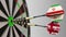 Flags of Iran and the United Kingdom on darts hitting bullseye of the target. International cooperation or competition