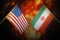 Flags of iran and United States of america against background of a fiery explosion. The concept of enmity and war