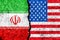 Flags of Iran and USA painted on cracked wall background/Iran versus USA conflict concept