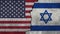 Flags of Israel and United States painted on the wall.