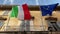 The flags of Italy and the European Union flying on the balcony of a public building