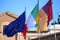 Flags of Italy, European Union and Roma city waving in Rome, Italy