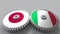 Flags of Japan and Italy on meshing gears. International cooperation conceptual animation