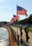 Flags-lined embankment of the Western Harbor at Stacy Blvd, Gloucester, MA, USA