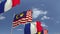 Flags of Malaysia and France against blue sky, loopable 3D animation