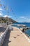 Flags and Pier in Kamini beach in Hydra Island