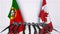 Flags of Portugal and Canada at international meeting or negotiations press conference