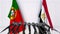 Flags of Portugal and Egypt at international meeting or negotiations press conference