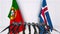 Flags of Portugal and Iceland at international meeting or negotiations press conference