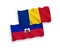 Flags of Romania and Republic of Haiti on a white background