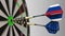 Flags of Russia and the European Union on darts hitting bullseye of the target. International cooperation or competition