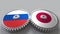 Flags of Russia and Japan on meshing gears. International cooperation conceptual animation