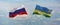 flags of Russia and Rwanda waving in the wind on flagpoles against sky with clouds on sunny day. Symbolizing relationship, dialog