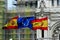 The flags of Spain and the European Union flutter in the wind creating a very institutional image