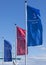 Flags at Stadersand pier showing the signage of the Hanseatic city of Stade