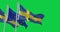 Flags of Sweden and the European Union waving isolated on a green background