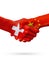 Flags Switzerland, China countries, partnership friendship handshake concept.