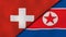 The flags of Switzerland and North Korea. News, reportage, business background. 3d illustration