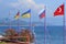 Flags of Turkey, Russia, Ukraine, Germany and Kazakhstan on the beach in Kemer