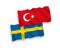 Flags of Turkey and Sweden on a white background