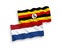 Flags of Uganda and Netherlands on a white background