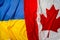 Flags of Ukraine and Canada folded together