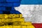 Flags of Ukraine and Crimea on a textured brick wall