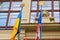 Flags of Ukraine and the Czech Republic on historic building in Prague. European support for Ukrainian refugees