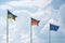 Flags of Ukraine, Germany and the European Union flutter on wind