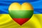 Flags of Ukraine and Lithuania. Heart color of the flag on the background of the flag of Ukraine. The concept of protection.