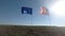 Flags of the United States of America and European Union waving together on the wind. Real shot in landscape.