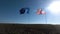 Flags of the United States of America and European Union waving together on the wind. Real shot in landscape.