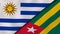 The flags of Uruguay and Togo. News, reportage, business background. 3d illustration