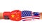 Flags of USA and China painted on two fists on sky background.