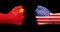 Flags of USA and China on two clenched fists facing each other on black background/usa china trade war concept