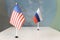 flags of the USA and Russia on the table. political negotiations between countries. concept of diplomacy and international