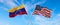 flags of USA and Venezuela waving in the wind on flagpoles against the sky with clouds on sunny day. Symbolizing relationship,