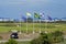 Flags in the wind and Parked golf cart at Rio Olympic Golf Course in Barra da Tijuca