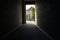 Flagstone paved passageway in building on sunny day