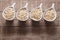 Flakes in white bowl on wooden table