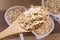 Flakes in white bowl on wooden table