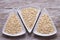 Flakes in white bowl on wooden table