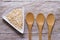 Flakes in white bowl on wooden table