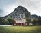 Flakstad Church with mountains in the background, exquisite XVIII century baroque masterpiece in the Arctic, Flakstadoy