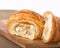 Flaky french croissant pulled apart