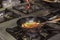 Flambe Chef Cooking in Kitchen. Professional chef in a commercial kitchen cooking flambe style. Chef Flambe Cooking