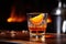 flambeing an orange peel in a sazerac cocktail