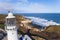 Flamborough Head Lighthouse. Drone aerial view of white beacon next to famous British white chalk cliff beach.