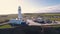 Flamborough Head Lighthouse. Drone aerial view of white beacon next to famous British white chalk cliff beach.